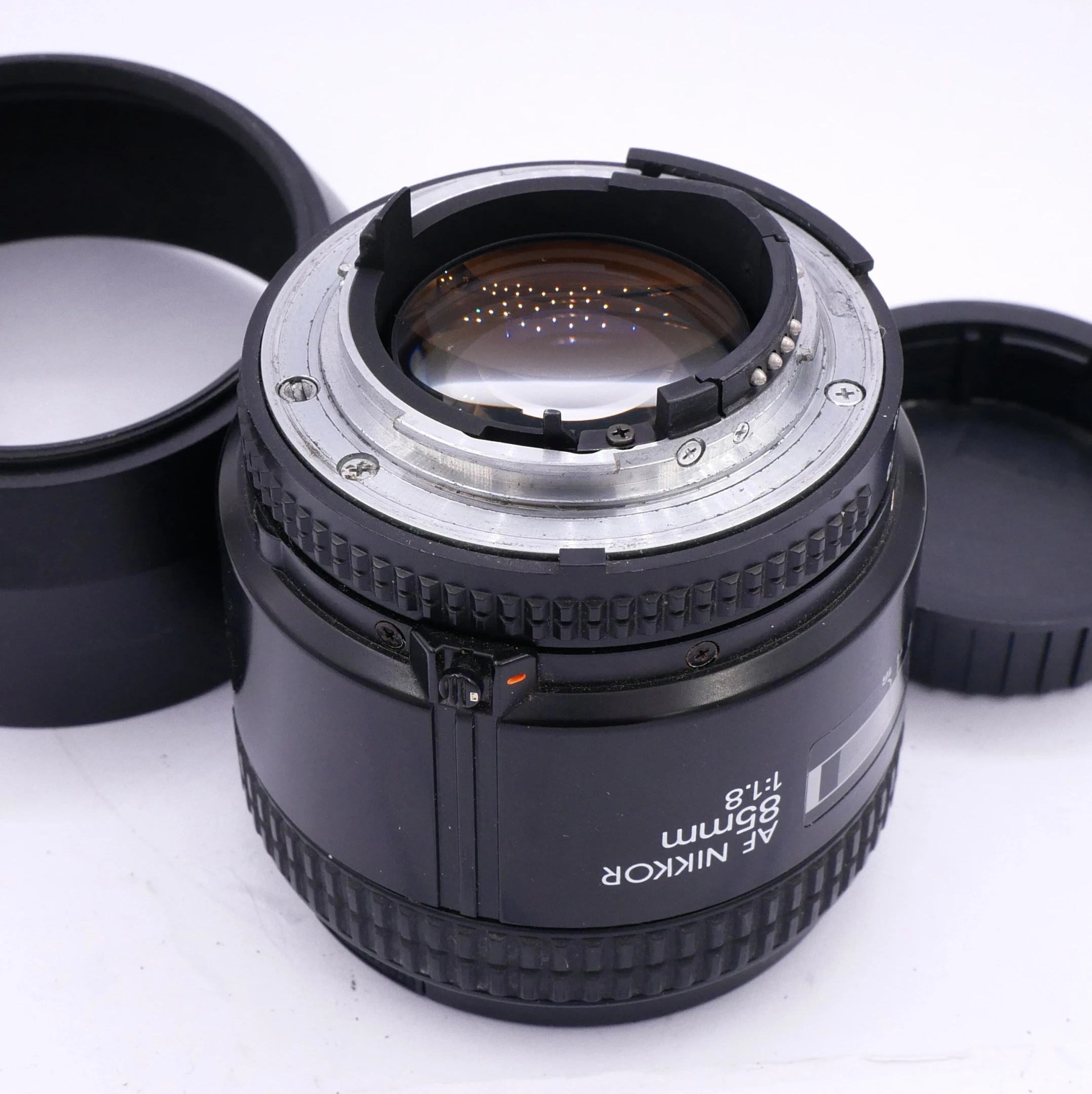 S-H-4R82T3_3.webp - Nikon AF 85mm F/1.8 Lens + Hood in F Mount (was $395) - Image 1