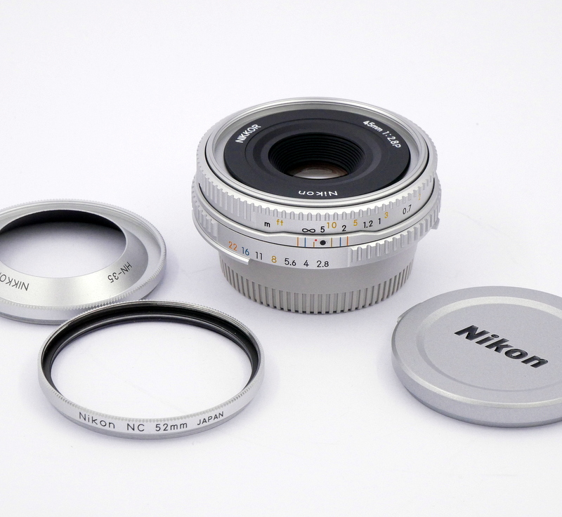 Nikon MF 45mm F/2.8 P Ais Lens with matching caps, filter and hood  - Best Available Image